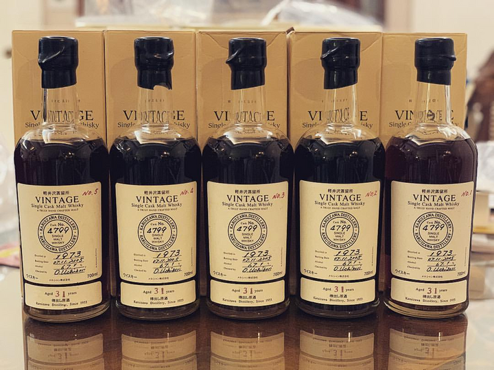 Five Karuizawa Vintage bottles and wooden cases