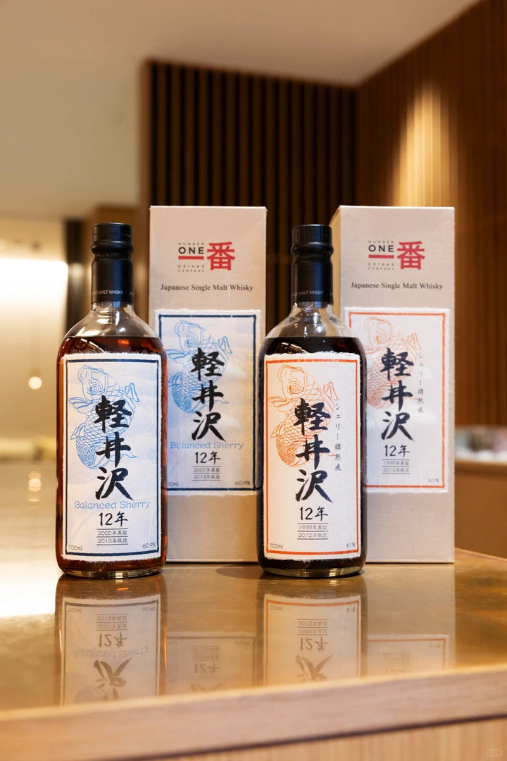 Three Karuizawa whisky bottles with illustrated boxes