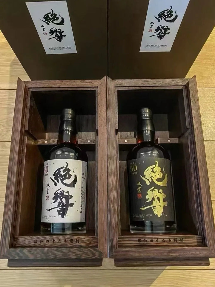 Two Karuizawa bottles inside an open wooden double-bottle presentation case