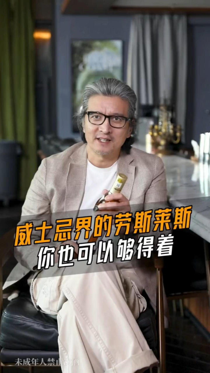 A video still of a presenter discussing whisky